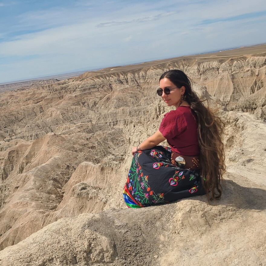 Rachel Billiot stops for a photo during a field trip to the Badlands with the Wichozani Program at Crazy Horse Memorial University in Spring 2026.