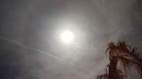 A lunar halo, which looks like a white ring around the moon