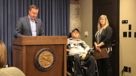 State Sen. Andy Manar (left) with David Spurney (middle) and his caregiver Tami Straub (right) at a press conference about the overtime cap for personal assistants. 