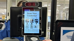 person scans mobile id from phone at TSA checkpoint
