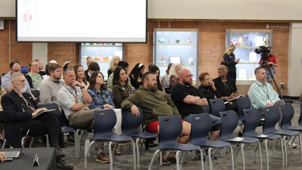 The gallery in the board meeting room on Monday was relatively full, with a number of people showing up to show their support for keeping schools open.