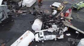 This image taken from video provided by the National Transportation Safety Board shows damage from a World War II-era B-17 bomber plane that crashed Wednesday, Oct. 2, 2019 in Windsor Locks, Conn. 