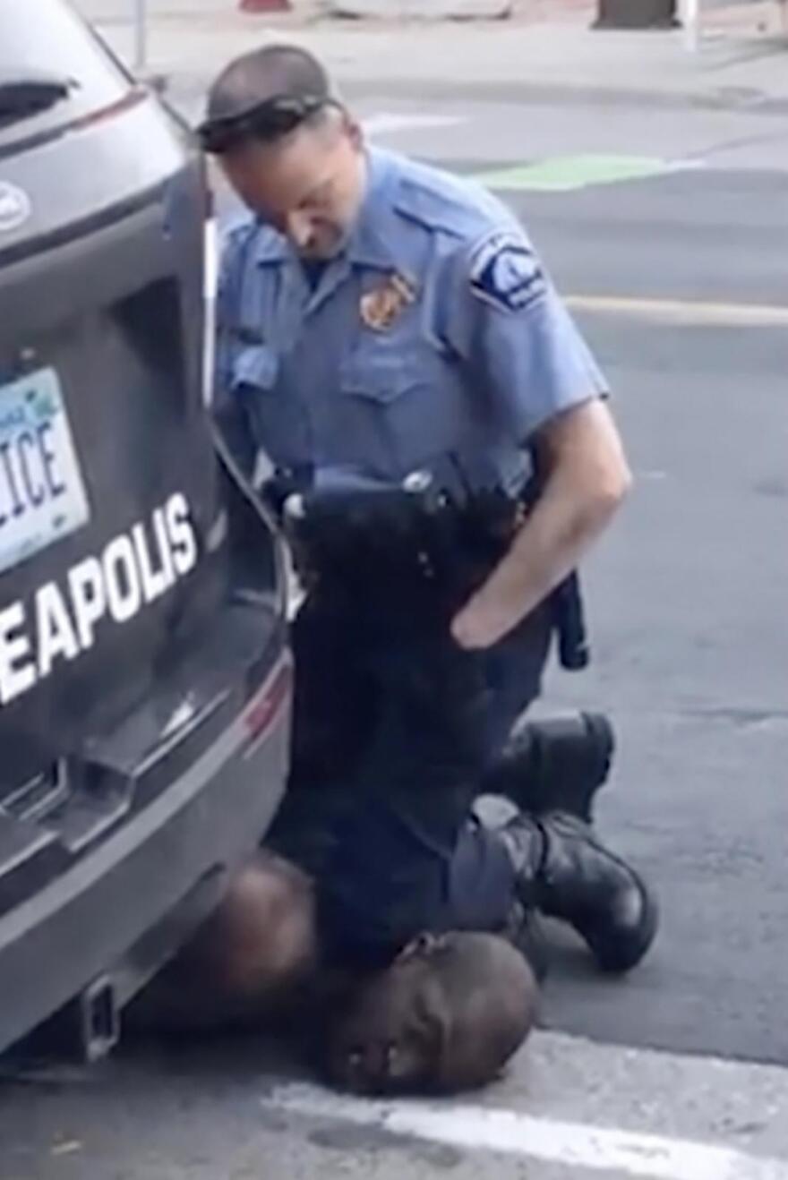 In this image from video provided by Darnella Frazier, Minneapolis Police Officer Derek Chauvin kneels on the neck of George Floyd, who was pleading that he could not breathe, in Minneapolis on Monday, May 25, 2020.