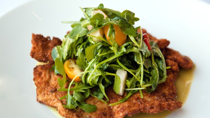 Crispy matzo-breaded chicken breast with a salad of arugula, tomatoes and jÃcama with tamarind vinaigrette and salsa verde.
