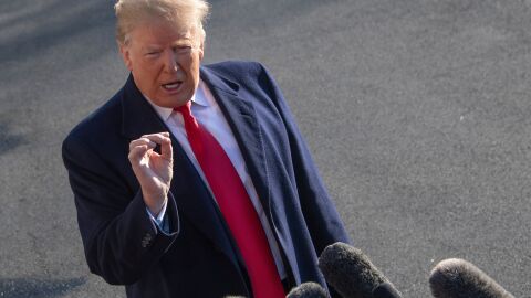 President Trump speaks as he leaves the White House for meetings at Camp David on Sunday. Trump stood firm on his demand for billions of dollars to fund a border wall with Mexico, which has forced a shutdown of the government now entering its third week.