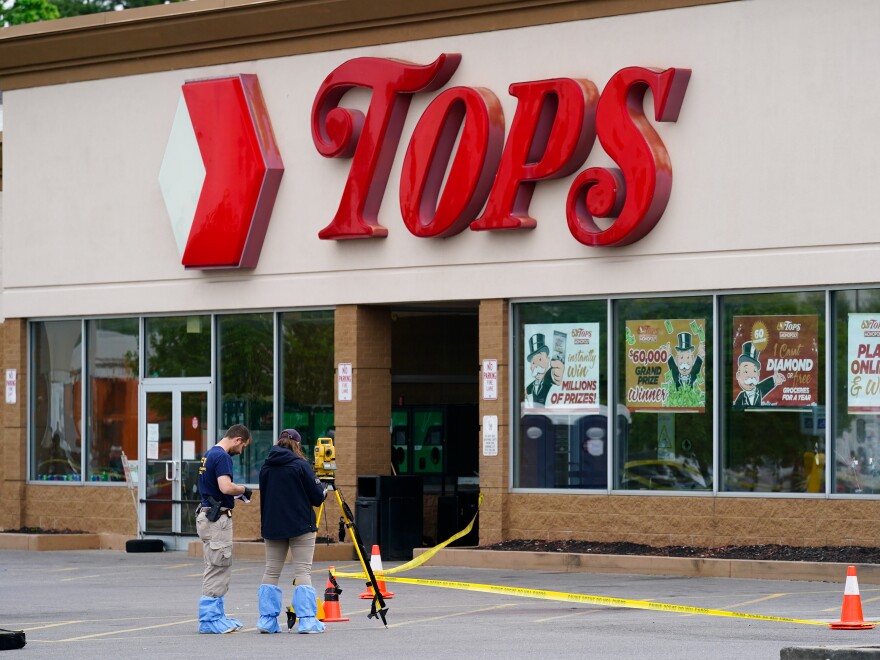 Investigators work the scene of a shooting at a supermarket in Buffalo, N.Y. on May 16.