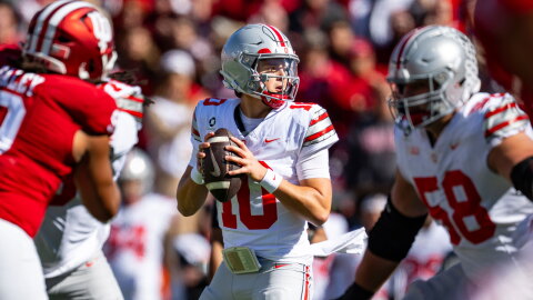 Ohio State quarterback Julian Sayin drops to pass during a college football game.