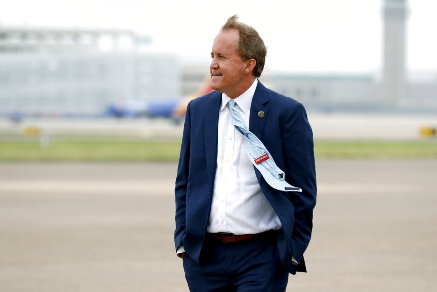 Texas State Attorney General Ken Paxton waits on the flight line for Vice President Mike Pence to arrive at Love Field in Dallas, Sunday, June 28, 2020. 