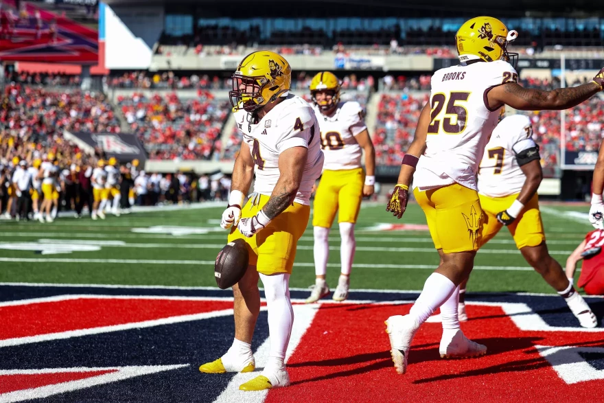 Arizona State running back Cam Skattebo (4) celebrates one of his three touchdowns during a standout performance in a 49-7 win over Arizona in Tucson on Saturday, Nov. 30, 2024.