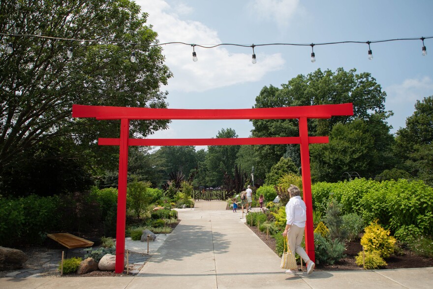 A Torii welcomes visitors to Cleveland Botanical Garden's "Between Water and Stone" exhibit on July 10, 2025. Toriis traditionally welcome guests into a shrine—in this case, it invites garden visitors to celebrate 50 years of the Japanese Water Garden, as part of a featured exhibit open through September 1.
