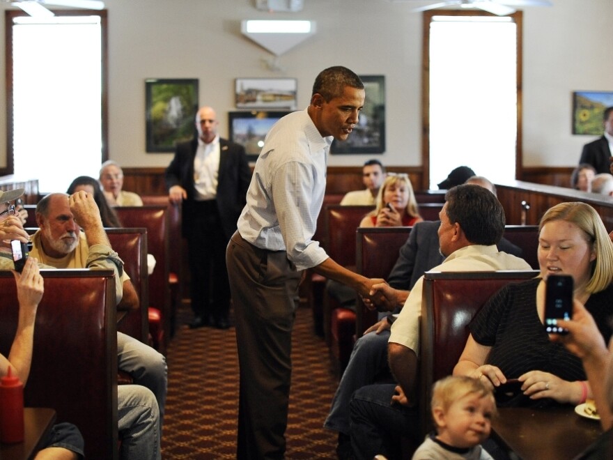 <p>President Barack Obama chats with people after ordering his lunch at Countryside Barbecue in Marion, N.C., Monday, during the first day of his three-day American Jobs Act bus tour to discuss jobs and the economy.</p>