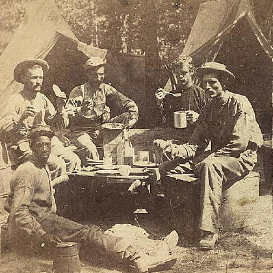<strong>At Least They Had Real Coffee: </strong>Union soldiers eat and drink in front of tents.