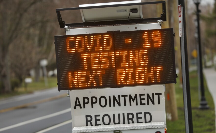 A digital sign on March 28 directs patients to the drive-through coronavirus test site at Stony Brook University in New York.