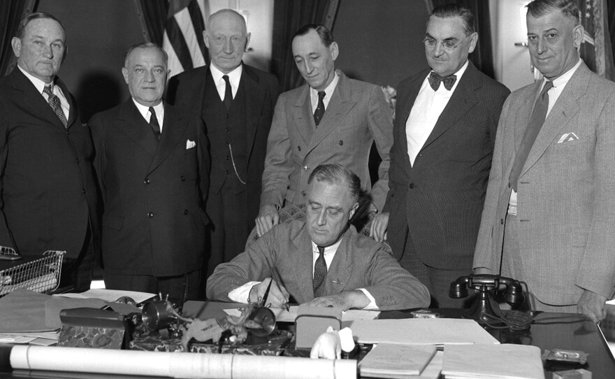 President Franklin D. Roosevelt, a Democrat, signs the National Industrial Recovery Act at the White House on June 16, 1933. After winning a fourth term, some state Republicans wanted distance from FDR on the ballot.