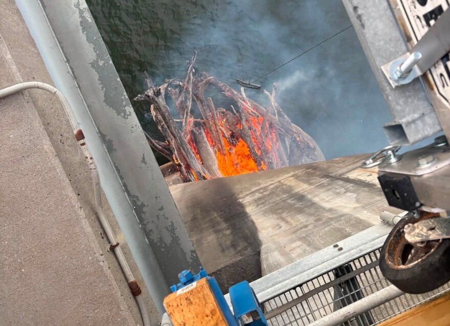 The view from above as a fire burns under the William Natcher Bridge, Monday evening, Aug. 10, 2026