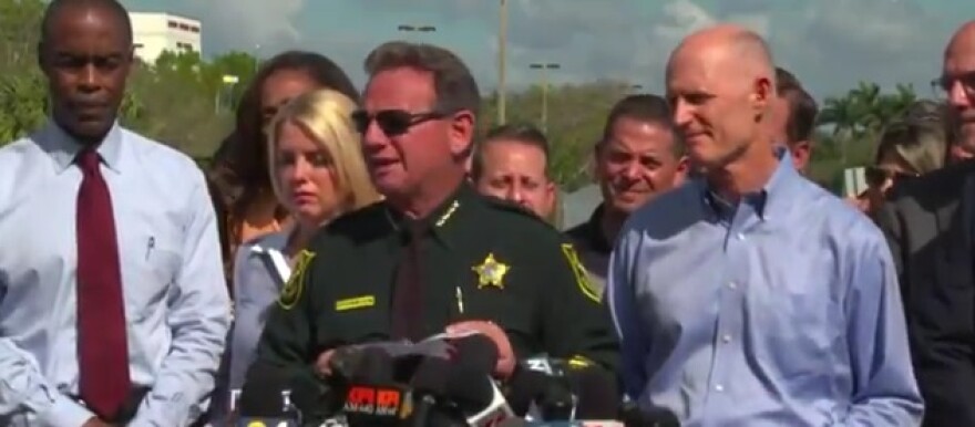Former Gov. Rick Scott with now suspended Broward Sheriff Scott Israel and Supt. Rob Runcie at a 2018 press conference following the shooting at Marjory Stoneman Douglas High School in Parkland, FL.