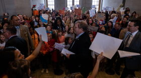 Tennessee state representives enter the house chamber ahead of session as protesters chant demanding action for gun reform laws in the state at the Tennessee State Capitol in Nashville, Tennessee.