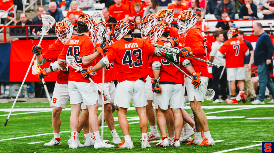 The Orange huddle in celebration after a second-quarter goal against Notre Dame