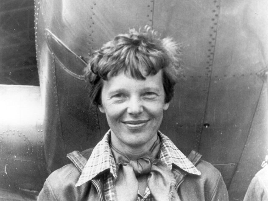 File photo of Amelia Earhart beneath the nose of her Lockheed Model 10 Electra in Oakland, California, in March 1937.