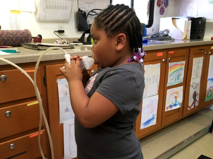 A lung test on the Breathmobile finds that 5-year-old Brooklyn Turner's pulmonary function is compromised by her asthma.
