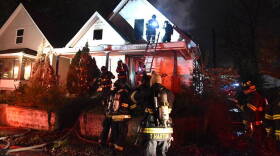 Three Indianapolis firefighters were slightly injured while battling a fire in a vacant building near the intersection of Michigan and Ketcham streets.
