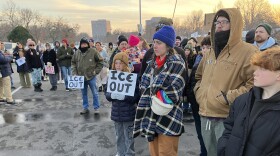 A crowd listens to a speaker at a vigil held at Tulsa's LaFortune Park on Tuesday, January 27, 2026.