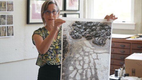 Marshall artist, photographer and writer Lauren Rutten, holding one of her original images for the project, Save This Piece, on Oct. 2