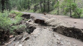 Massive water flows washed out a portion of Schultz Pass Road in Flagstaff in 2022 during major post-wildfire flooding triggered by the 26,000-acre Pipeline Fire.