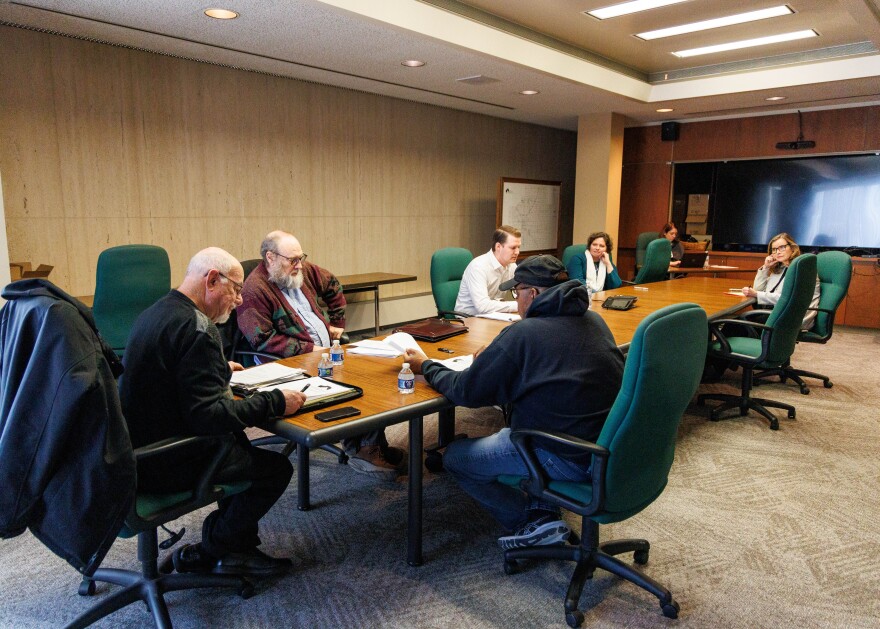 The McLean County Ethics Commission meets Thursday, Feb. 20, 2025, at the Government Center in Bloomington. On the right, County Administrator Cassy Taylor and McLean County Board chair Elizabeth Johnston are seated at the table.
