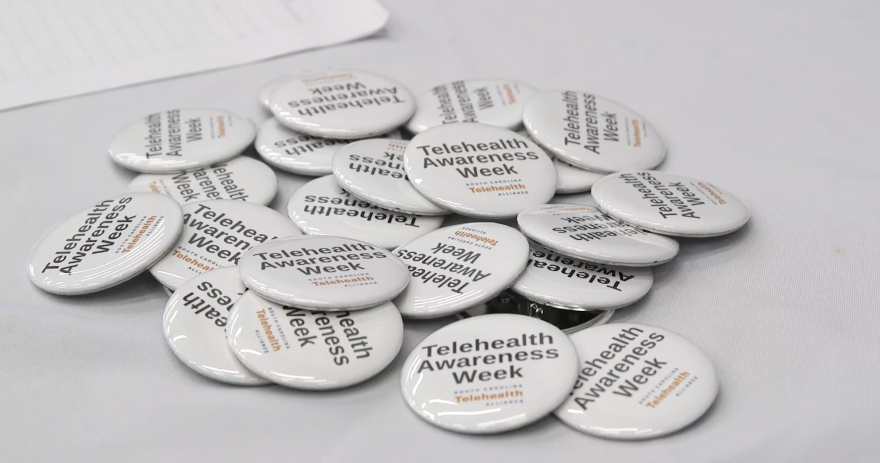 FILE- Telehealth Awareness Week buttons