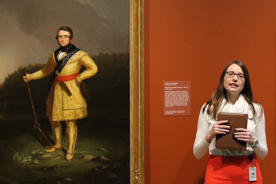 Assistant Curator of American Art at the St. Louis Art Museum Janeen Turk before Bingham painting