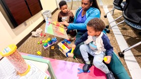 Ashlie Butler reads to her kids Ace,5, and Acai, 2, on Monday, November 4, 2024 Blightpoint Community College in Chester, Virginia.