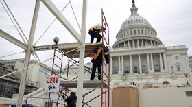 Employees of the Architect of the Capitol build a scaffolding at the West Front of the Capitol as construction of the 2017 presidential inaugural platform continues Dec. 8, 2016 on Capitol Hill in Washington, D.C. (Alex Wong/Getty Images)