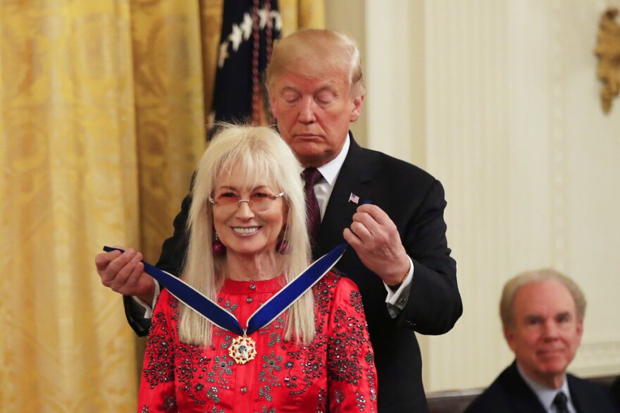 President Donald Trump presents the Presidential Medal of Freedom to Miriam Adelson during a ceremony in the East Room of the White House, in Washington, Friday, Nov. 16, 2018.