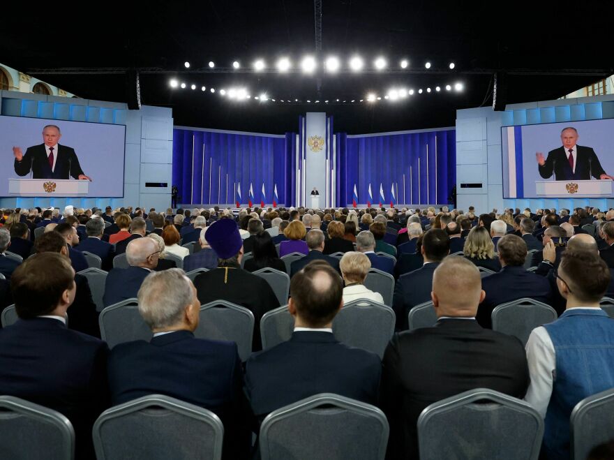 Russian President Vladimir Putin delivers his annual state of the nation address in central Moscow on Feb. 21. Putin hasn't pulled back on using "denazification" as his stated goal for the offensive in Ukraine.