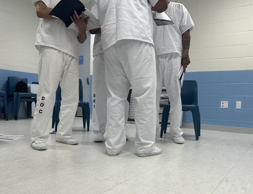 Participants in the RTA program rehearse the poem provided by the course.