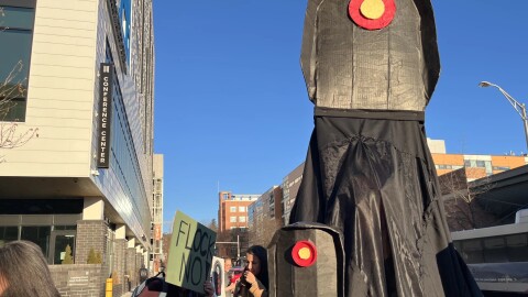 A protester dressed as a Flock Camera at Wednesday's rally.