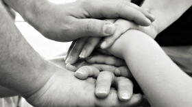 Family with overlapping hands
