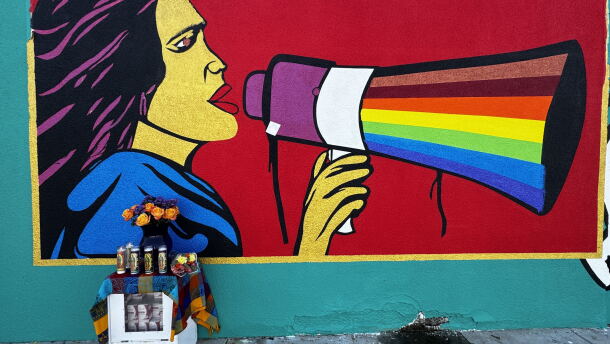 A mural of Dolores Huerta is painted outside a Bakersfield meat market.