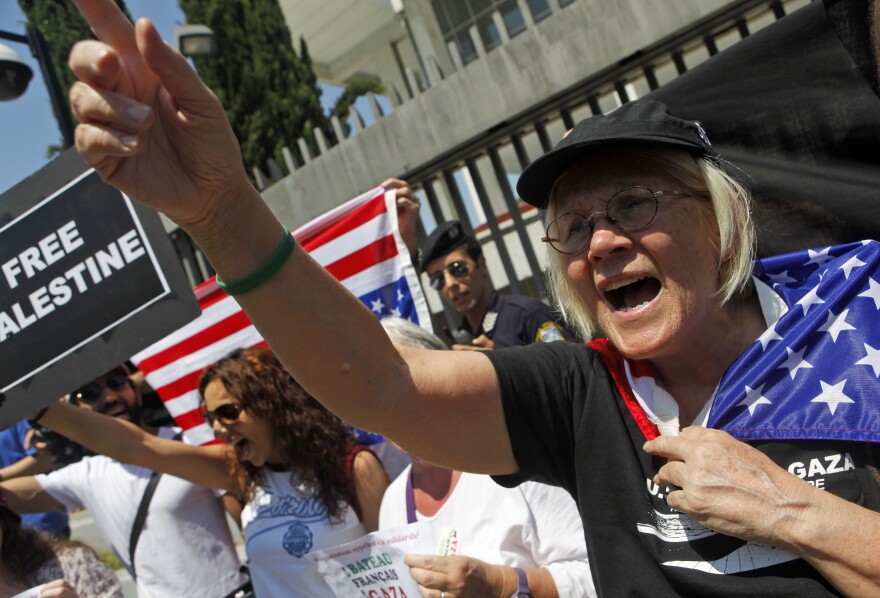 Ann Wright, 64, from Honolulu, chants slogans as she and other activists rally in protest outside the U.S. embassy in Athens, Greece, Friday, July 1, 2011.
