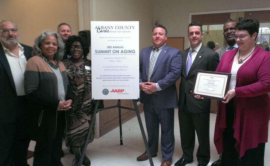  Albany County legislators Paul Burgdorf, Wanda Willingham, Norma Chapman, Legislature Chair Sean Ward (back), CE McCoy, Legislator Andrew Joyce  and AARP’s Derrick Holmes and Laura Palmer.