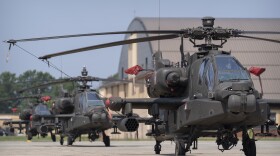 FILE - U.S. Army AH-64E Apache helicopters are pictured at Joint Base Andrews, Md., June 12, 2025. (AP Photo/Mark Schiefelbein, File)