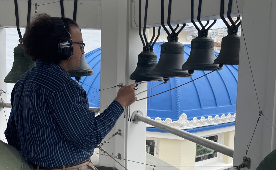 A man ringing church bells. 