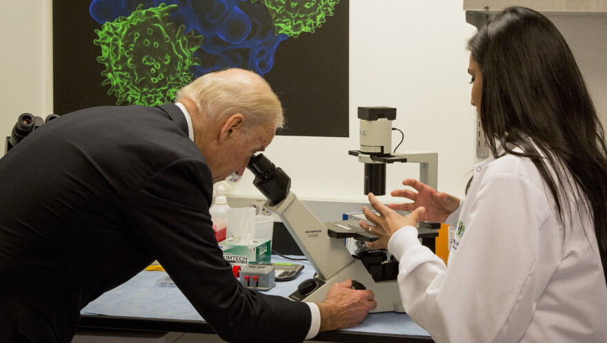 Vice President Joe Biden toured the lab at Fred Hutchinson Cancer Research Center before holding a roundtable meeting with scientists there. Biden says he's encouraged to see more cooperation between researchers and doctors. 