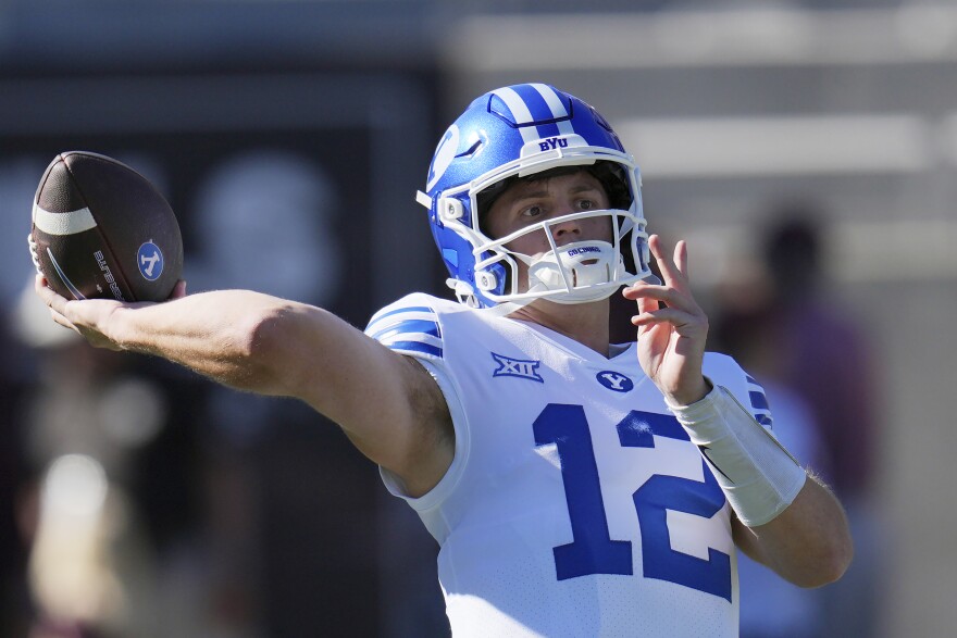 FILE - BYU quarterback Jake Retzlaff warms up prior to an NCAA college football game against Arizona State, Nov. 23, 2024, in Tempe, Ariz. (AP Photo/Ross D. Franklin, File)