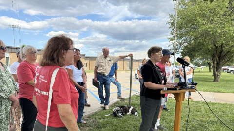 Group of community members standing outside of Montgomery Middle School.