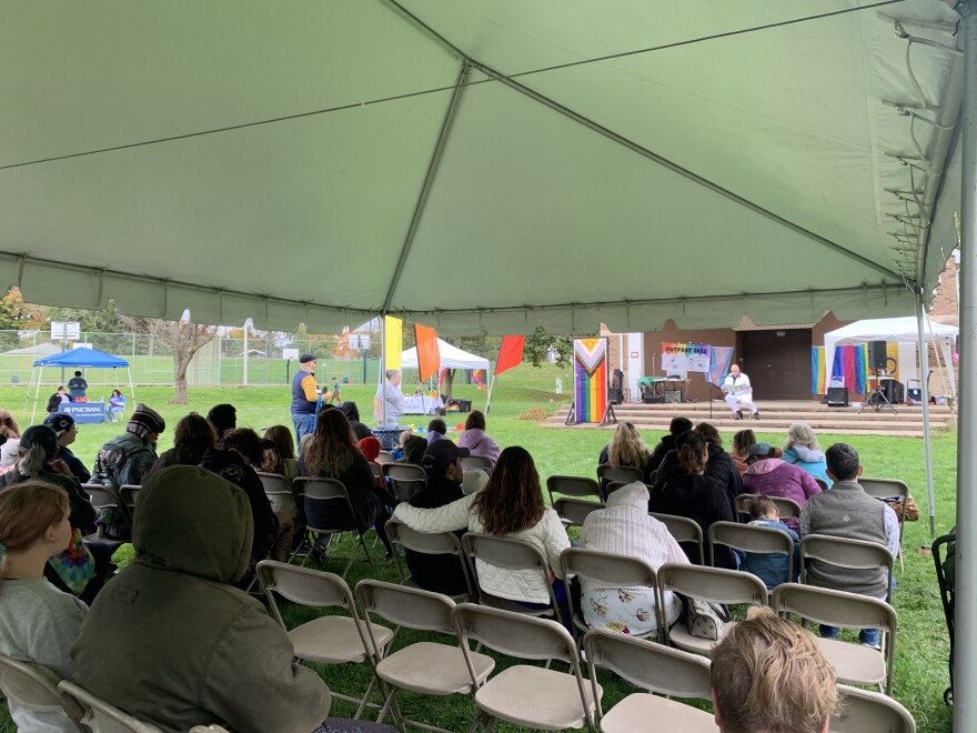 Andronica (John Oates) reads a children's book to the crowd.