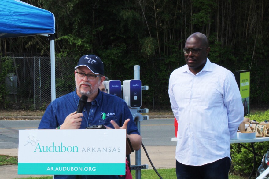 Audubon Delta Arkansas Policy Manager Glen Hooks introduced Little Rock Mayor Frank Scott Jr. at the "Drive Electric for Earth Day" event before the dedication of electric vehicle charging stations in the parking lot of the Little Rock Zoo.