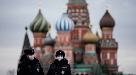 Russian police officers patrol on March 30, 2020 on the deserted Red square in front of Saint Basil's Cathedral in Moscow as the city and its surrounding regions imposed lockdowns. (Dimitar Dilkoff/AFP/Getty Images)