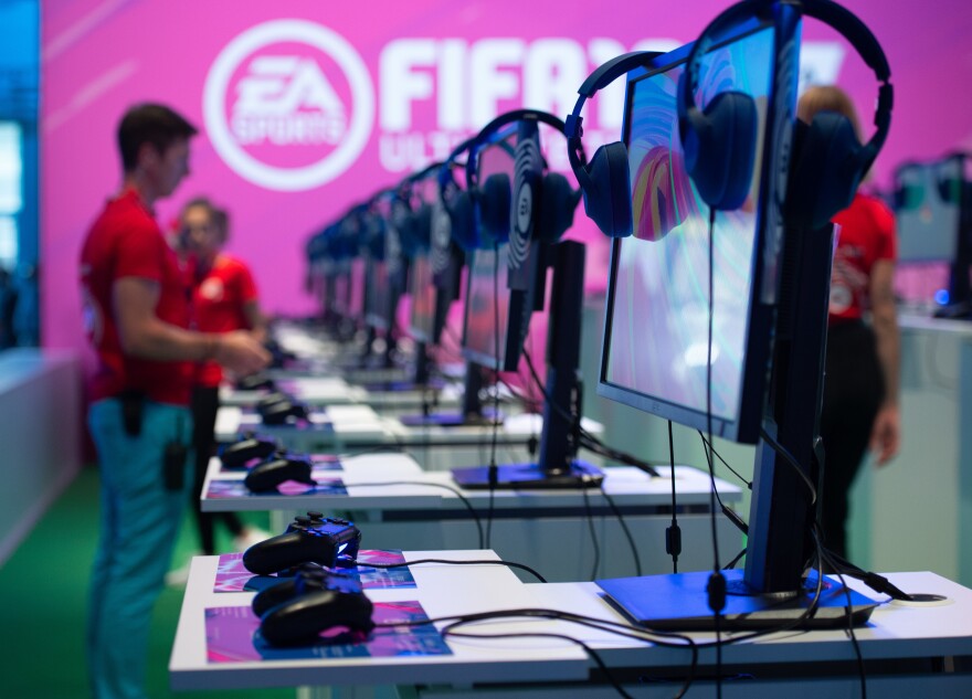 Gaming consoles where visitors can try out the "Fifa 19" video game are seen at the booth of EA Sports during the Gamescom convention in 2019 in Cologne, Germany.